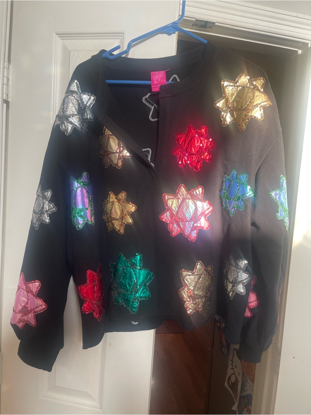 QUEEN OF SPARKLES Black Sweatshirt with Multicolored Metallic Bow Appliqués larg